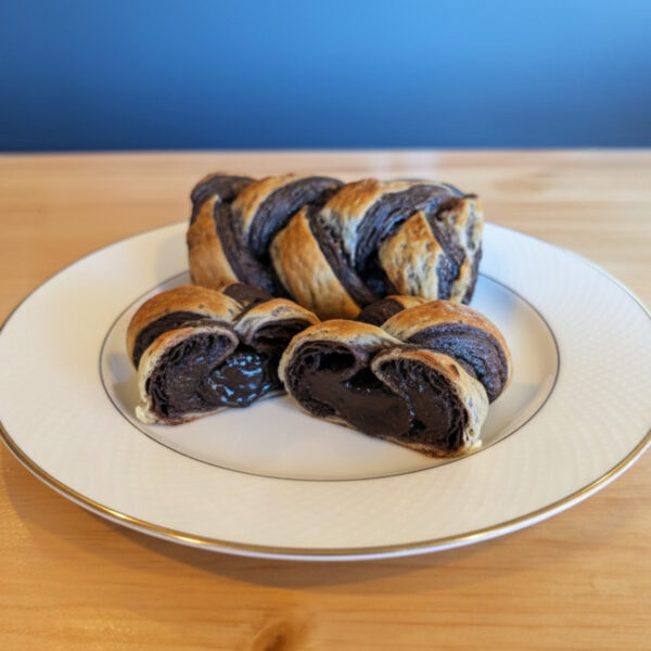 Loaf of braided bread filled with chocolate swirls