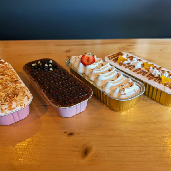 Dessert sampler box with tiramisu and tres leches slices