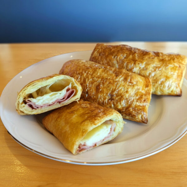 Venezuelan ham and cheese cachitos puff pastry rolls on a sm