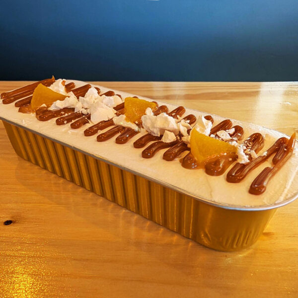 Slice of Chajá cake with cream and peaches